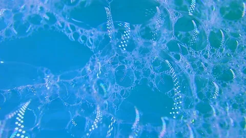 Soap foam with bursting large and small bubbles. Foam background Stock Footage 220667040