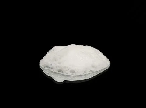 Soap foam on a dark background. Texture of white soap foam Stock Photos