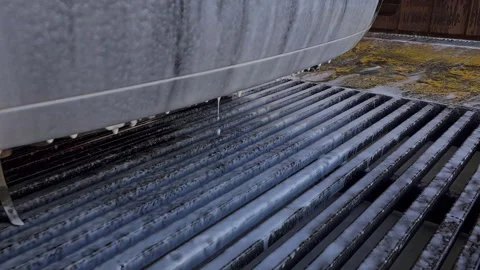 Soap foam flows down the surface of a black passenger car during a self-service Stock Footage 274440952