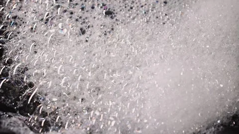 Soap foam isolated on black background, detailed bubble texture for cleaning Stock Footage 339179736