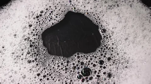 Soap foam isolated on black background, detailed bubble texture for cleaning Stock Footage 339179753
