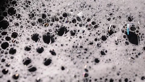 Soap foam isolated on black background, detailed bubble texture for cleaning Stock Footage 339179922