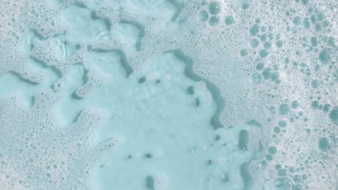 Soap Foam Moving in Blue Background. Natural White Shampoo Bubbles Motion Stock-Footage 270936228