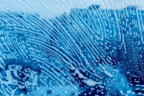 Soap foam pattern on glass Stock Photos