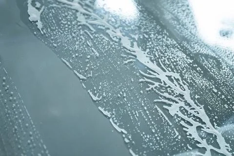 Soap Foam Texture on Car Window During Vehicle Wash Foto stock