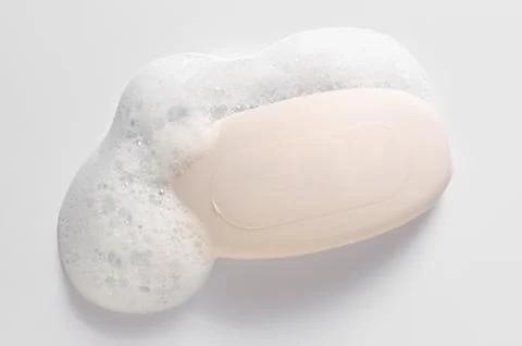 Soap with foam on a white background. Stock Photos