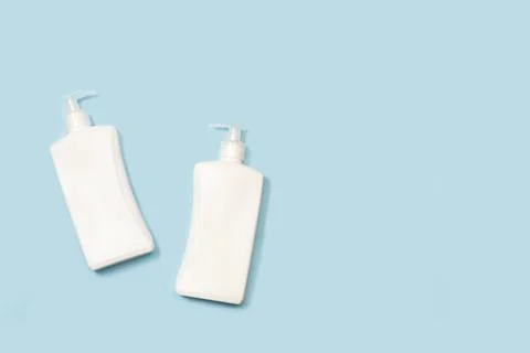Soap gel bottles on a light blue background with copy space Stock Photos