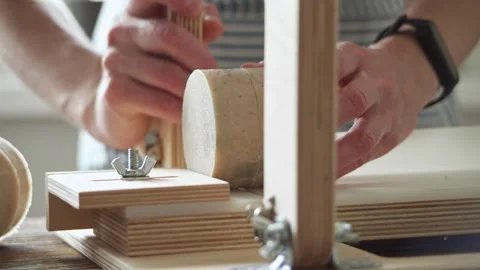 Soap maker cuts a round handmade soap on a wooden cutter.  Stock Footage 277873310