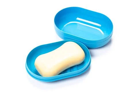 Soap in PLASTIC COLORED soap dish isolated on white background Stock Photos