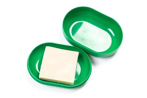 Soap in PLASTIC COLORED soap dish isolated on white background Stock Photos