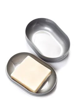 Soap in PLASTIC COLORED soap dish isolated on white background Stock Photos