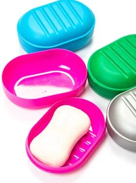 Soap in PLASTIC COLORED soap dish isolated on white background Stock Photos