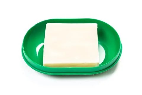 Soap in PLASTIC COLORED soap dish isolated on white background Stock Photos