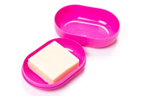 Soap in PLASTIC COLORED soap dish isolated on white background Stock Photos