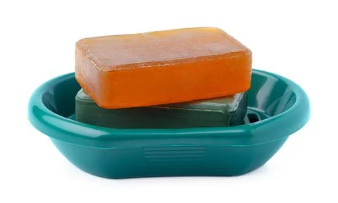 Soap on a plastic soap dish isolated on a white background Stock Photos