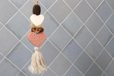 Soap in the shape of a heart on the background tiles in the bathroom Stock Photos