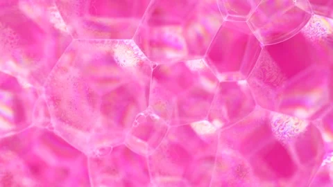 Soap sud macro structure. Pink foam soap with bubbles, rotates abstract bac.. Stock Footage 247906440