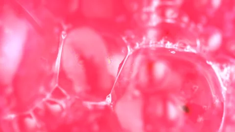 Soap sud macro structure. Pink foam soap with bubbles, rotates abstract bac.. Stock Footage 255599056