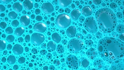 Soap sud microstructure. Blue foam soap with bubbles, rotates abstract back.. Stock Footage 249504677