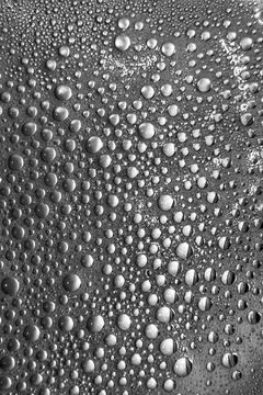 Soap suds bubbles create shiny metallic background plate Stock Photos