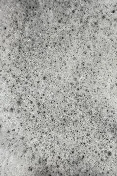 Soap suds foam and bubbles create organic background plate Stock Photos