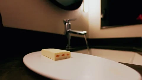 Soap on tray with water running in background Stock Footage 311531850