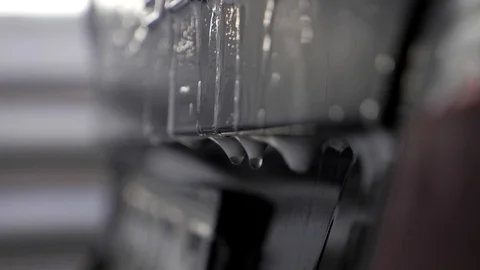 Soap water drops drip after black car washing close up slow motion. Stock Footage 86437310