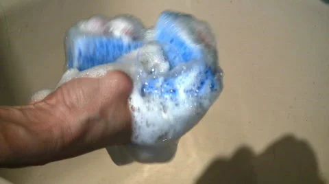 Soapy sponge in sink Stock Footage 461343