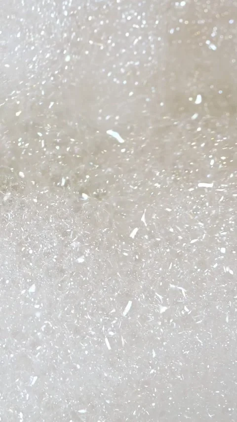 Soapy water creating sparkling white foam with shimmering bubbles in a relaxing Stock Footage 341677238