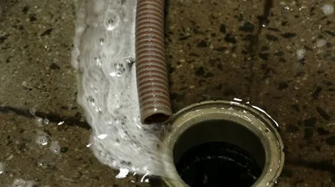 Soapy Water Goes Down Floor Drain Near Hose Stock Footage 12673559