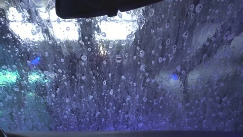 Soapy Windshield Of A Car Inside An Automated Carwash. POV Stock Footage 180054396