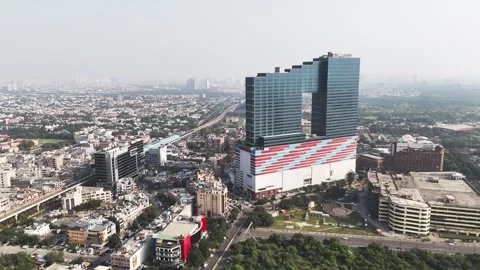 Soaring above Noida’s skyline, this drone view highlights contemporary Stock Footage 325373202