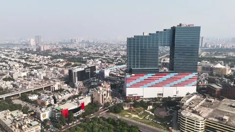 Soaring above Noida’s skyline, this drone view highlights contemporary Stock Footage 325373209