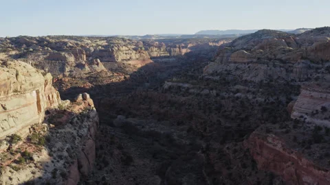 Soaring above shadow covered Calf Creek rock gorge in Escalante Utah, sunset Stock-Footage 248559543