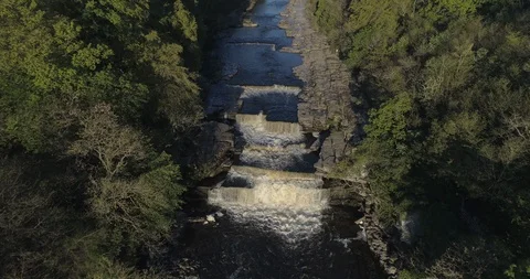 Soaring above a waterfall Stock Footage 114019477