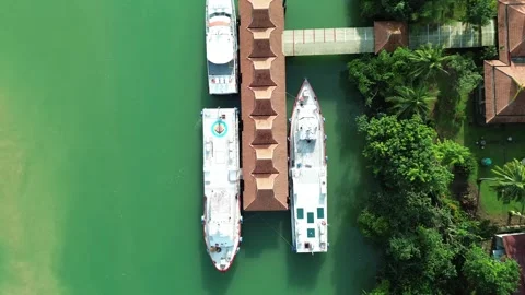 Soaring aerial perspective showcasing multiple vessels docked along Stock-Footage 325201687