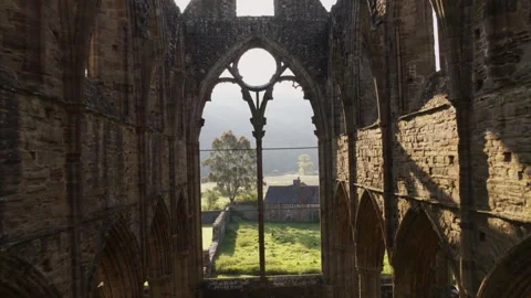 Soaring aerial view inside Tintern Abbey ruins Video stock 336775289
