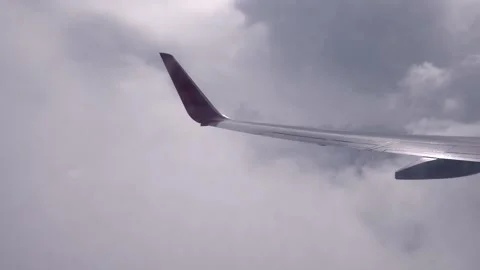 Soaring Dreams: Clouds and Wingscape Stock Footage 263728430
