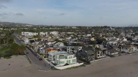 Soaring By Large Beach Homes Stock Footage 339706825