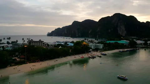 Soaring over the beach to the sea in the evening Stock Footage 232728273
