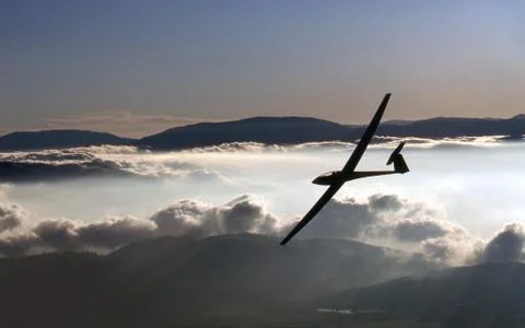 Soaring over clouds Stock Photos
