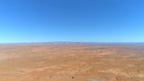 Soaring over the gorgeous flat bed of the Monument Valley park, flying above the 스톡 동영상 114459575