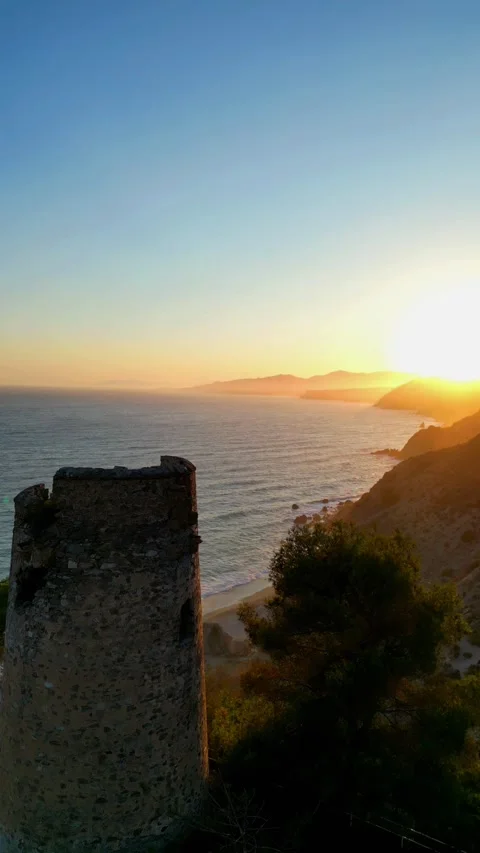 Soaring Over Maro Tower and the Rugged Coast 4k Stock Footage 282673437