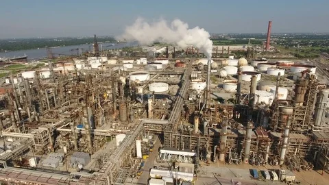 Soaring Over Oil Refinery Through Smoke From Tower Revealing New Orleans Stock Footage 78718989