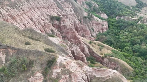 Soaring Over the Unusual Eroded Slopes of Râpa Roșie, Romania Stock Footage 314237411