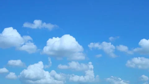 Soaring Puffy White Clouds and Blue Clear Sky on a Sunny Clear Day, Slow Motion, Stock Footage 245972616