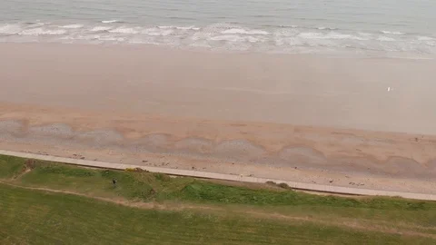 Soaring rc glider plane beside a beach Stock Footage 106393774