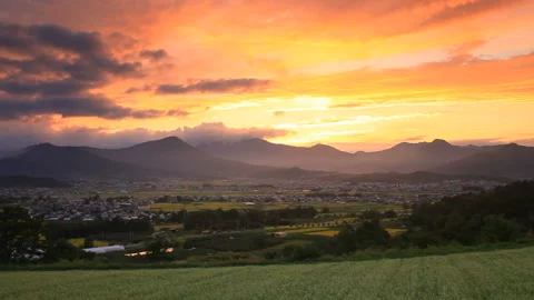 Soba Fields in Bloom, Salt Pans, and the Mountain of the Husband God at Sunset 스톡 동영상 330429120