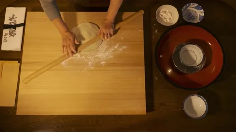 Soba making, rolling out the dough with rolling pin Stock Footage 223377341