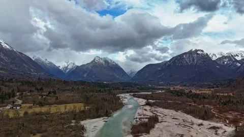 Soča River in snowy Soča Valley beneath the Julian Alps, Slovenia by drone Video stock 340587918